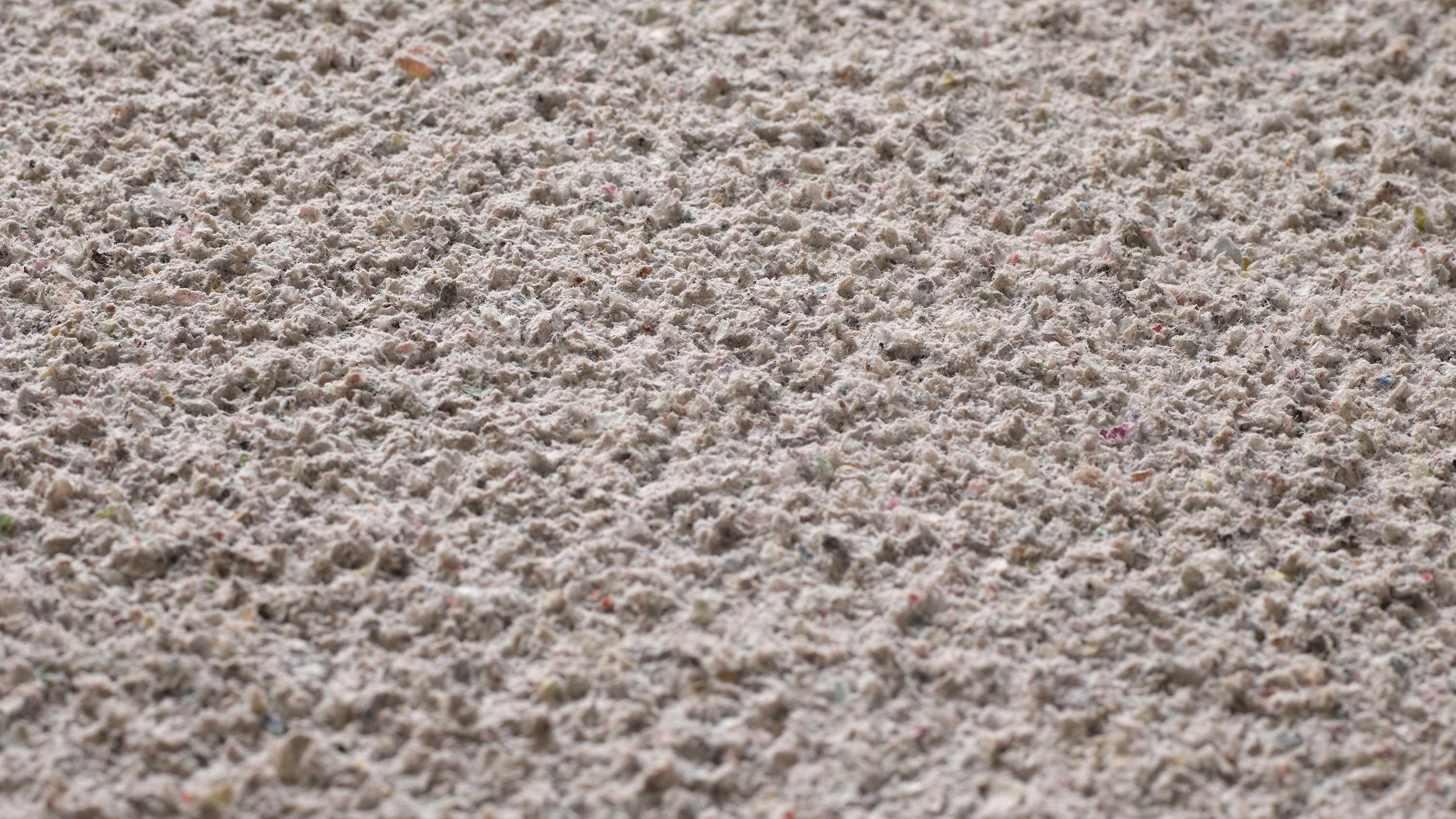 Close-up texture of Acosorb acoustic plaster product